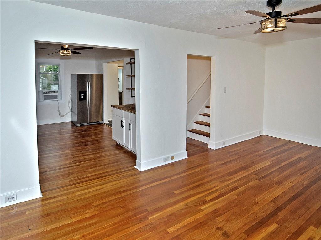 1423 Chislett Street Pittsburgh, PA 15206 - Photo 42 of 47 wooden floor in an empty room with a window