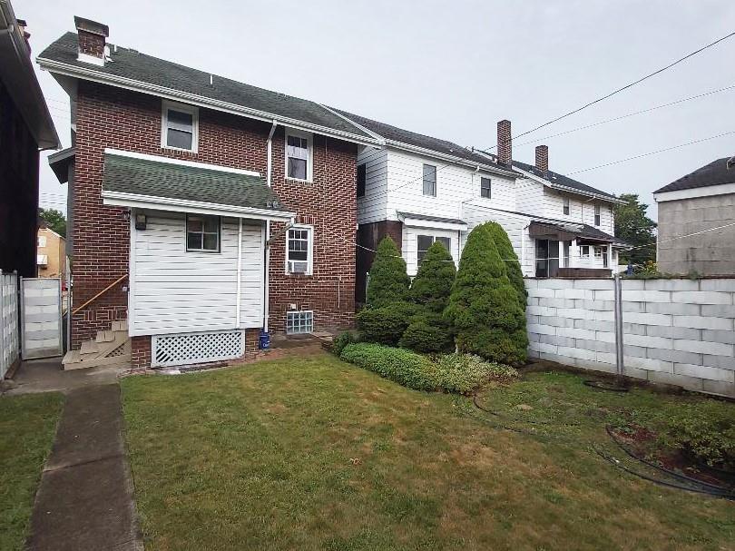 1423 Chislett Street Pittsburgh, PA 15206 - Photo 44 of 47 a front view of a house with a yard