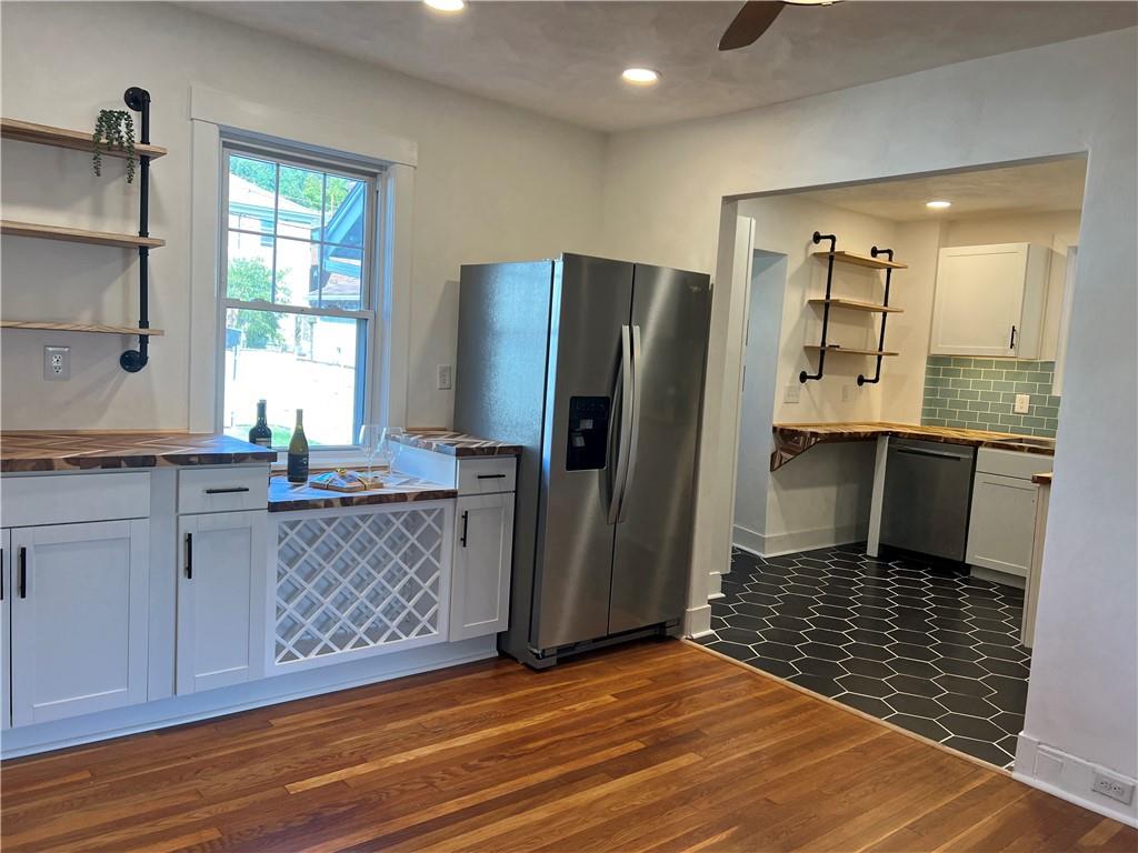 1423 Chislett Street Pittsburgh, PA 15206 - Photo 6 of 47 a kitchen with stainless steel appliances granite countertop a refrigerator and a sink