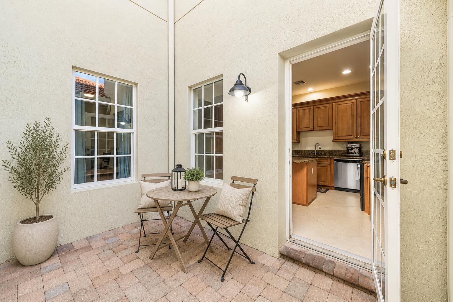 704 Northwest 83rd Place Boca Raton, FL 33487 - Photo 15 of 37 Private patio staged