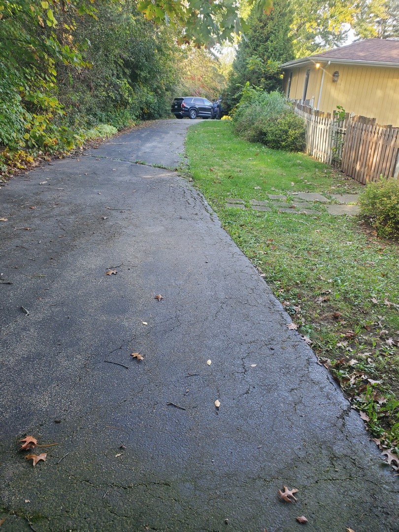 20525 Ridgeview Drive Marengo, IL 60152 - Photo 20 of 20 a view of a yard with plants and a lake view