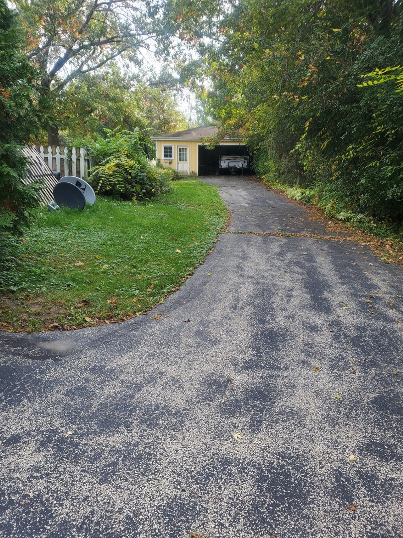 20525 Ridgeview Drive Marengo, IL 60152 - Photo 3 of 20 a view of a garden with large trees