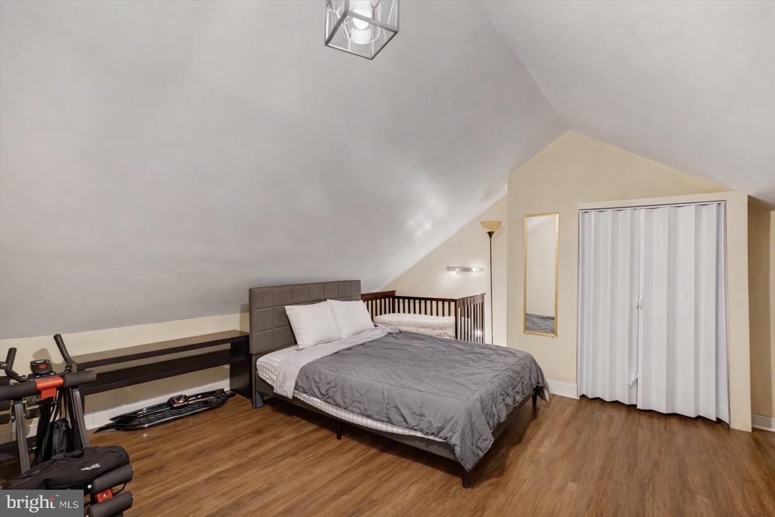 442 South Duke Street York, PA 17401 - Photo 13 of 24 a bedroom with a bed closet and wooden floor