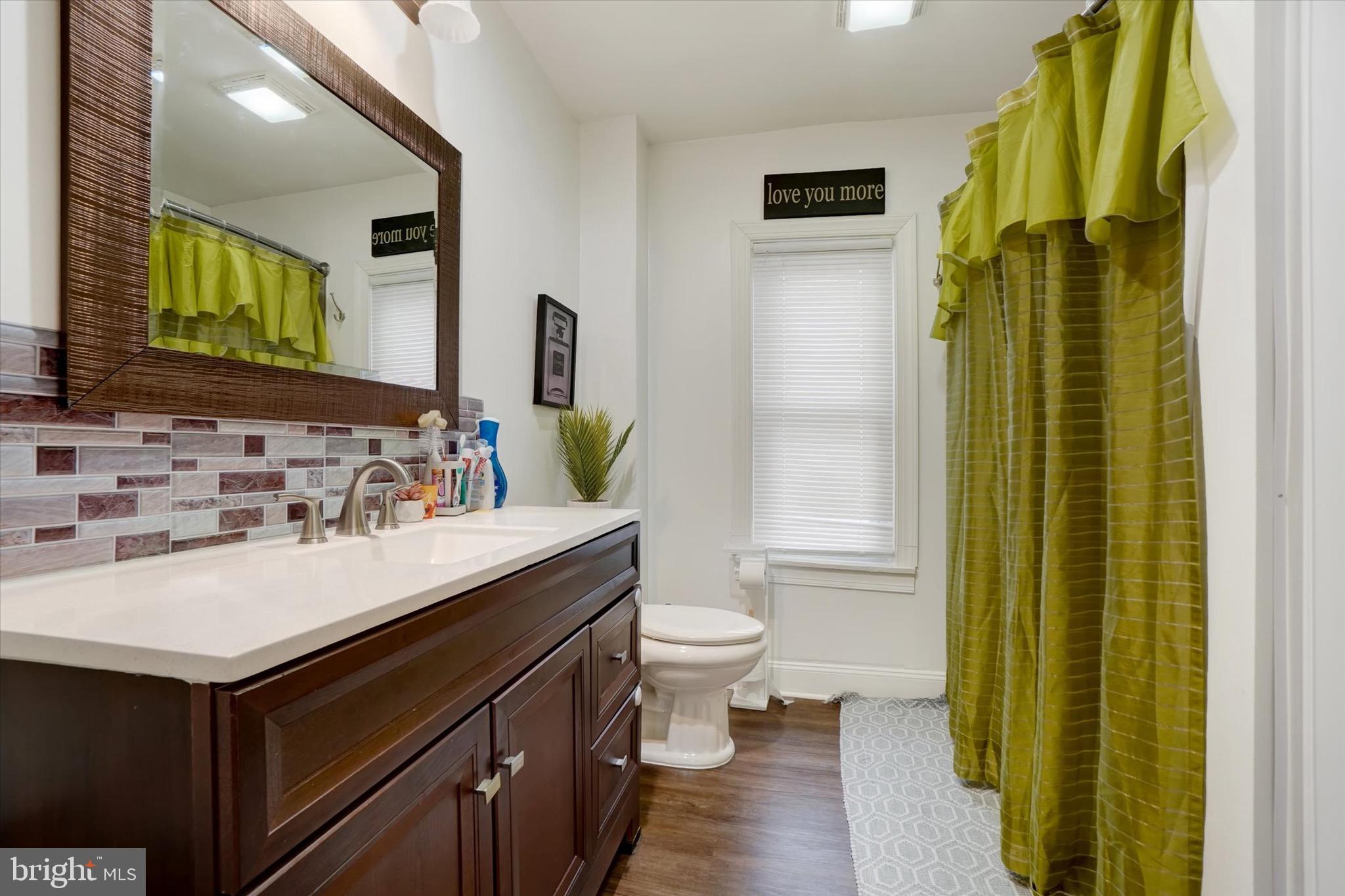 442 South Duke Street York, PA 17401 - Photo 14 of 24 a bathroom with a sink and a mirror