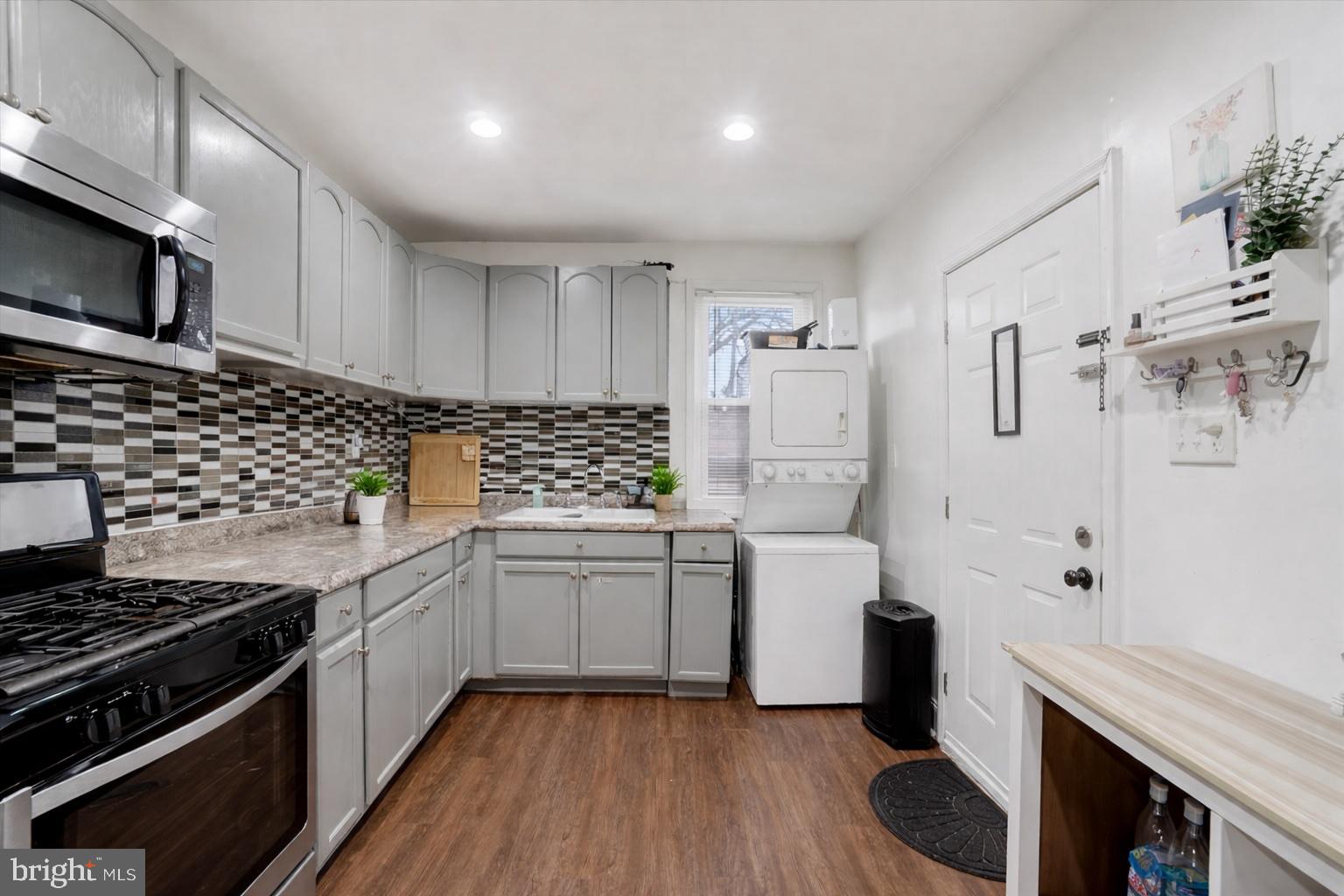 442 South Duke Street York, PA 17401 - Photo 5 of 24 a kitchen with white cabinets and appliances