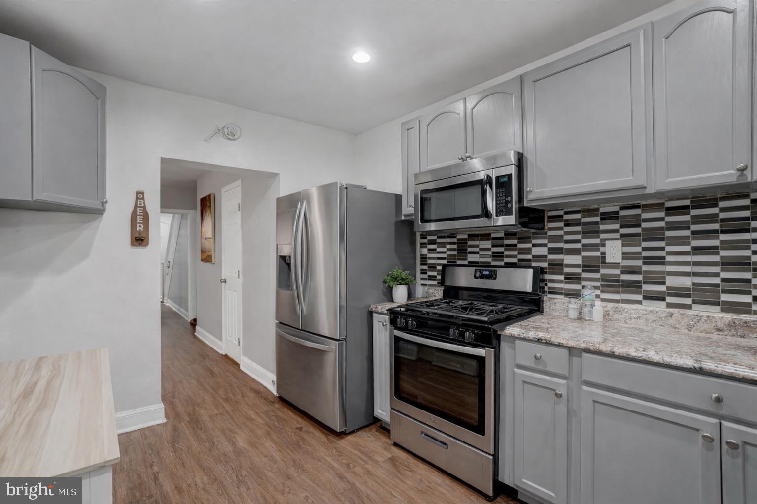 442 South Duke Street York, PA 17401 - Photo 6 of 24 a kitchen with a sink stove and refrigerator