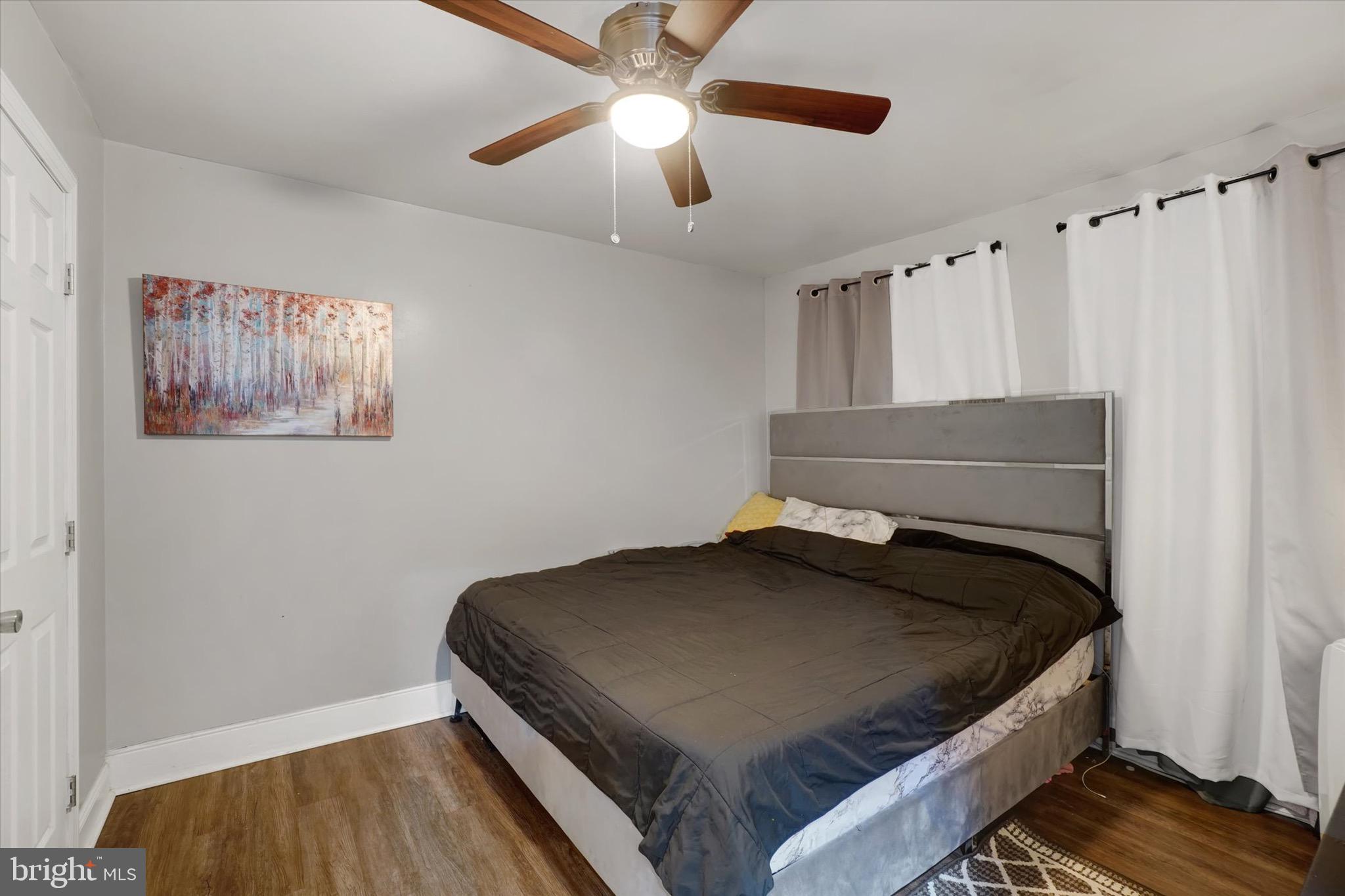 442 South Duke Street York, PA 17401 - Photo 10 of 24 a bedroom with a bed and a chandelier