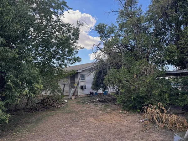 a view of a house with a tree