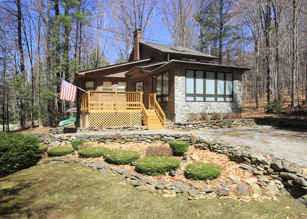 38 Ridge Road Tolland, MA 01034 - Photo 1 of 21 a front view of a house with a yard