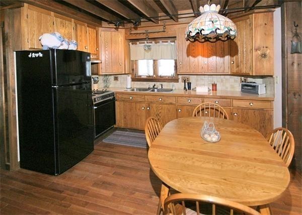 38 Ridge Road Tolland, MA 01034 - Photo 11 of 21 a kitchen with stainless steel appliances granite countertop a sink and a refrigerator