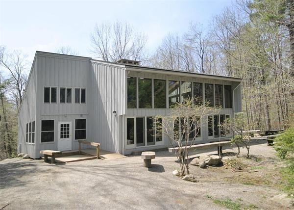 38 Ridge Road Tolland, MA 01034 - Photo 21 of 21 a front view of a house with parking area