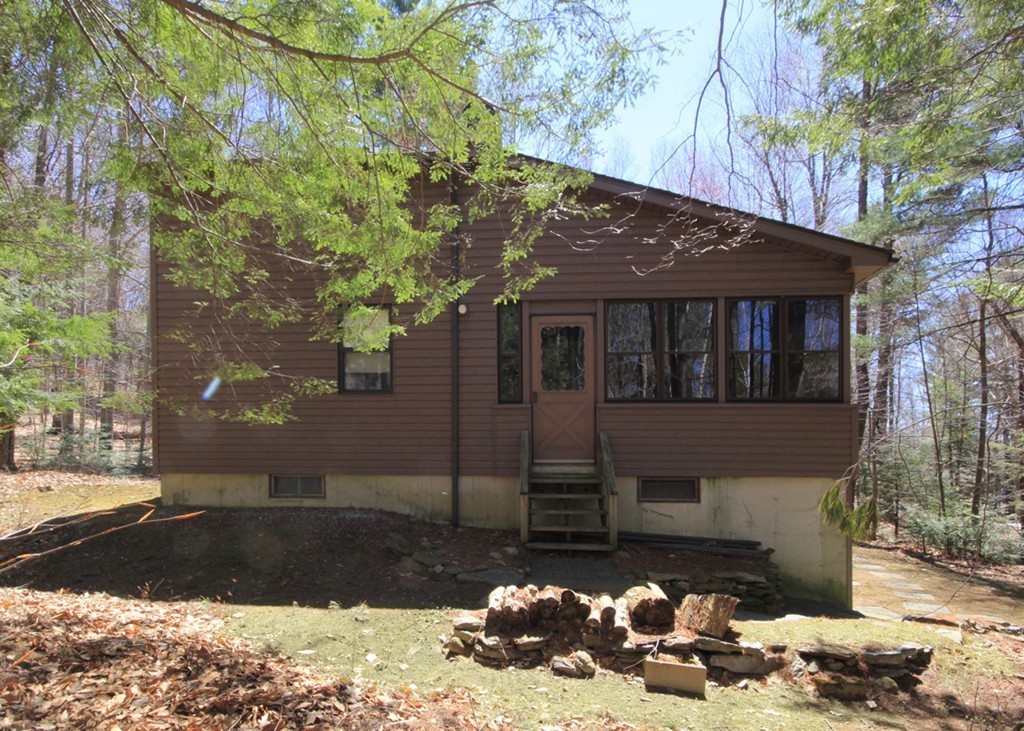 38 Ridge Road Tolland, MA 01034 - Photo 5 of 21 a front view of a house with a yard