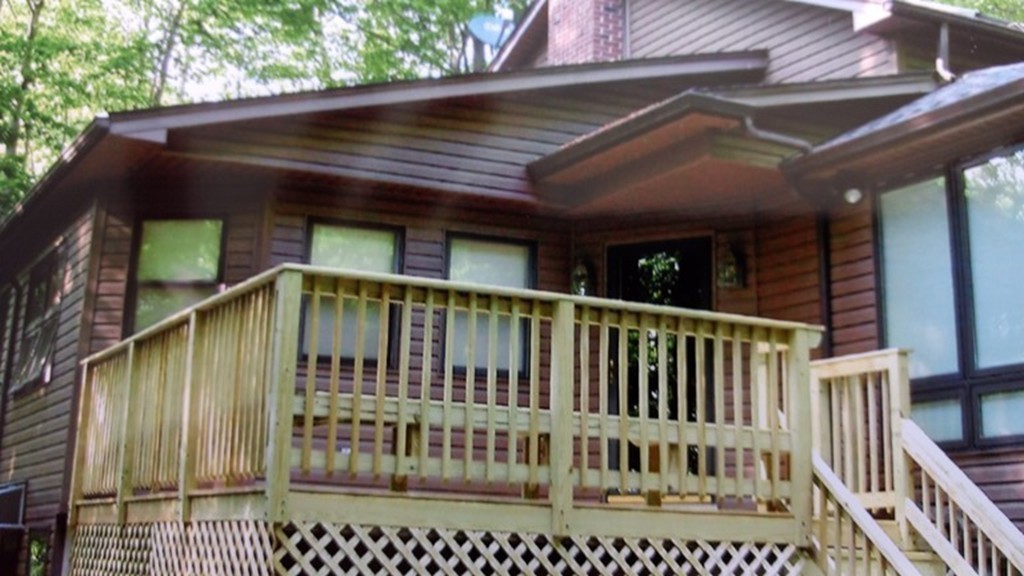 38 Ridge Road Tolland, MA 01034 - Photo 7 of 21 a view of a chair and table in the balcony