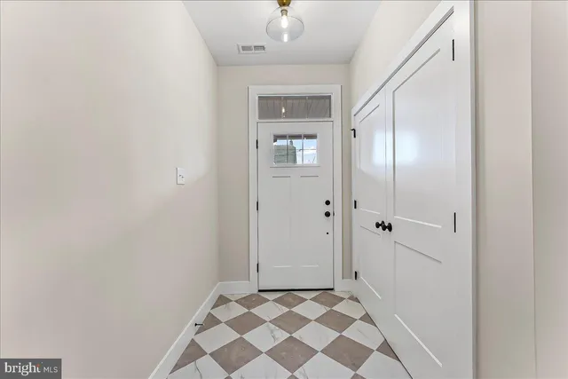 a view of a bathroom with a sink and a mirror