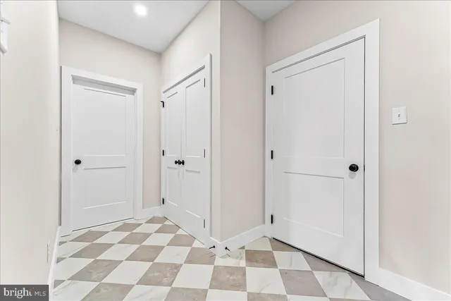 a view of a closet area with an empty space