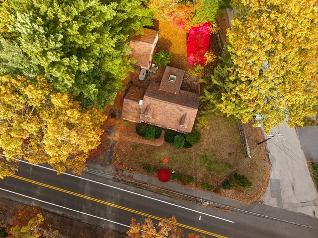 an aerial view of residential houses with outdoor space