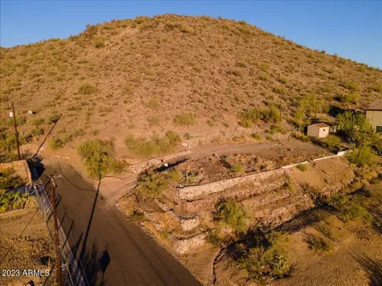 an aerial view of residential houses with city view
