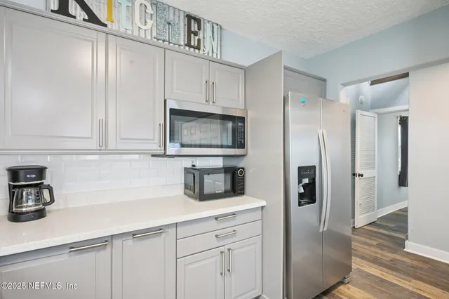 a bedroom with a large bed and a large window