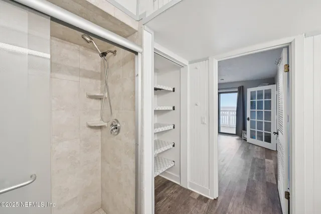 a kitchen with a window a refrigerator and a table