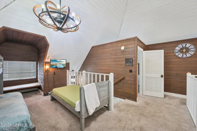 a view of a terrace with lawn chairs