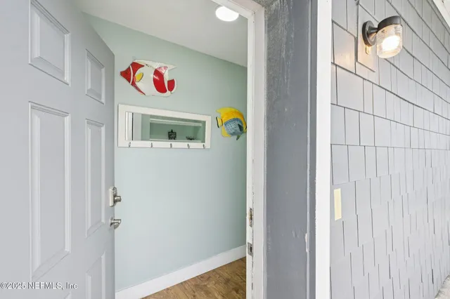 an aerial view of a house with swimming pool in front of it
