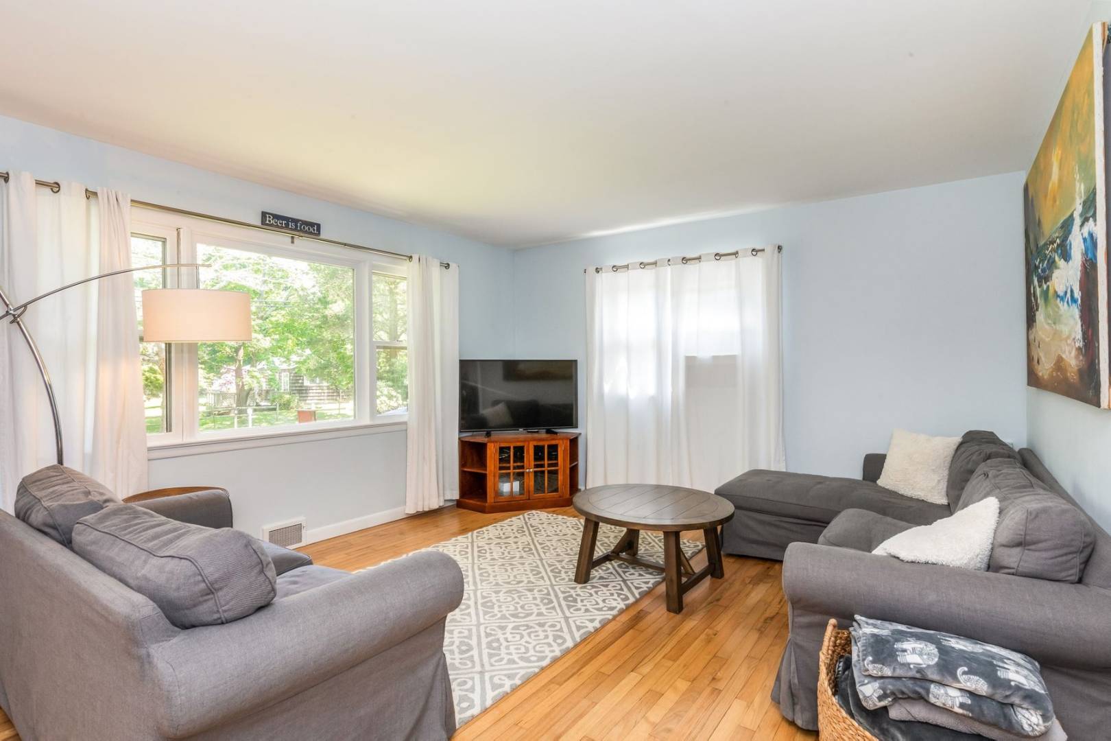8 Bruce Lane East Hampton, NY 11937 - Photo 2 of 13 a living room with furniture and a flat screen tv
