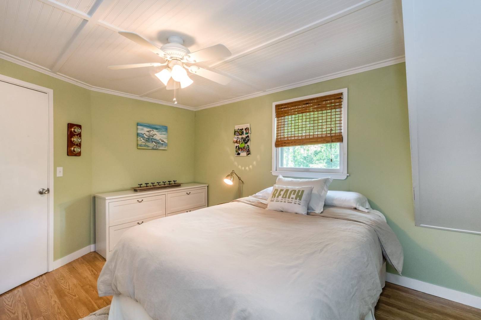 8 Bruce Lane East Hampton, NY 11937 - Photo 13 of 13 a bedroom with a bed and a chandelier
