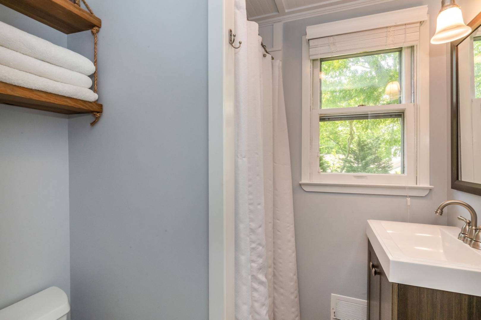 8 Bruce Lane East Hampton, NY 11937 - Photo 5 of 13 a bathroom with a sink and a toilet