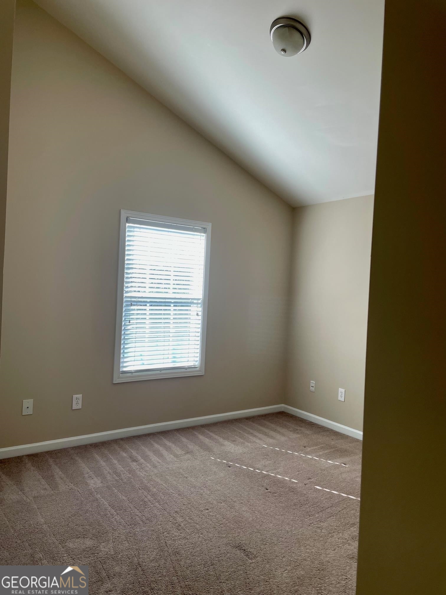 5371 Apple Grove Road Northeast Buford, GA 30519 - Photo 12 of 17 an empty room with a window