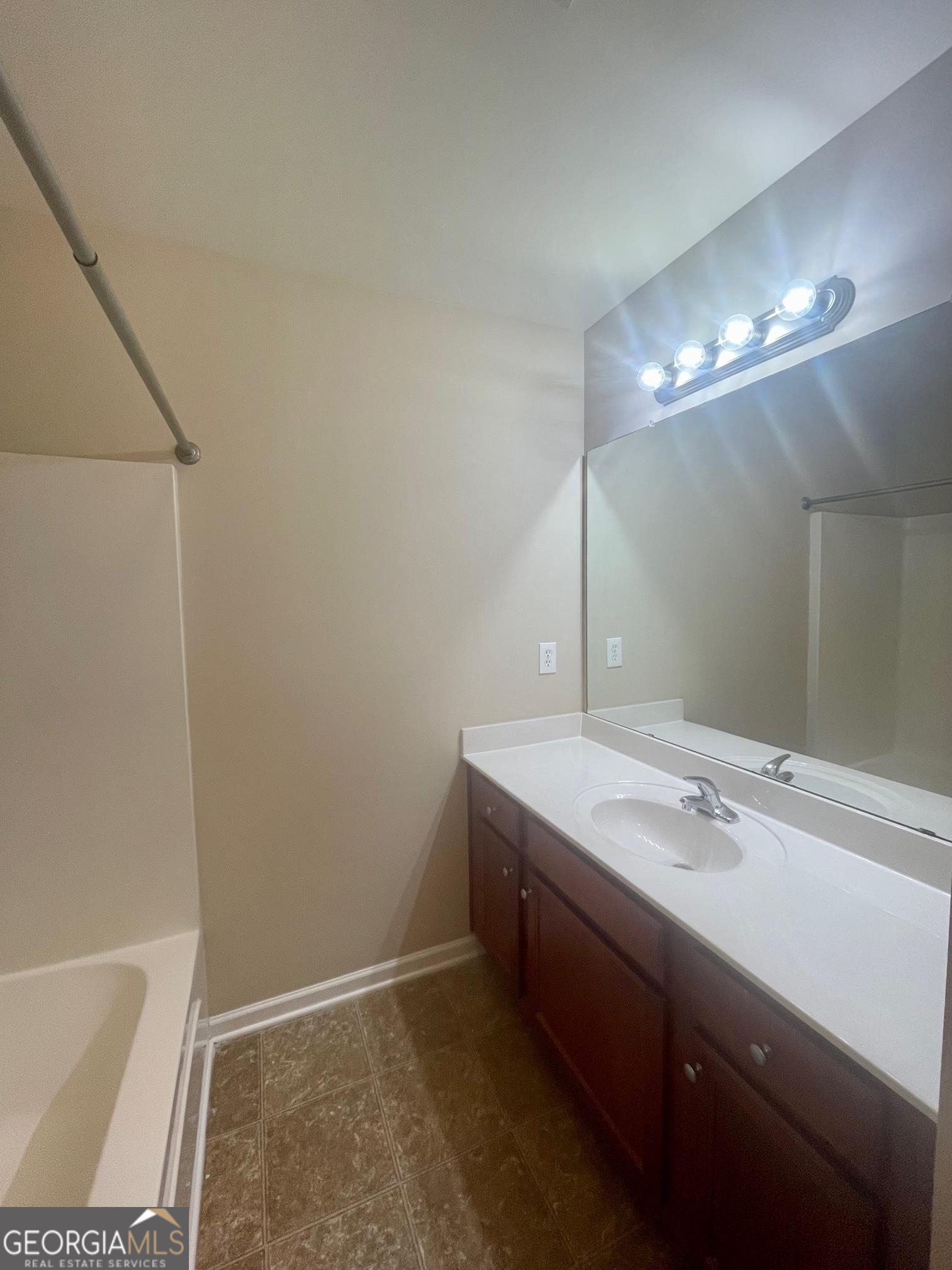 5371 Apple Grove Road Northeast Buford, GA 30519 - Photo 13 of 17 a bathroom with a sink and a mirror