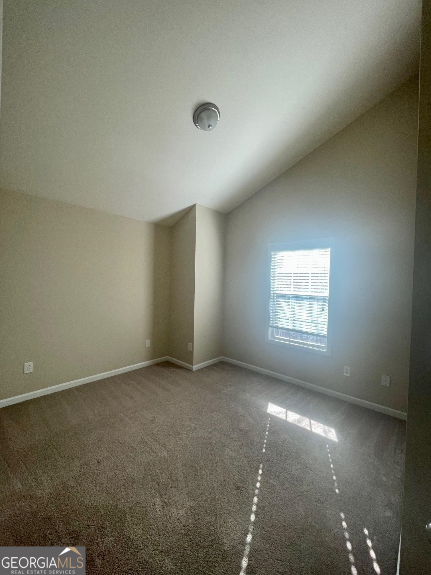 5371 Apple Grove Road Northeast Buford, GA 30519 - Photo 14 of 17 an empty room with a empty space and windows