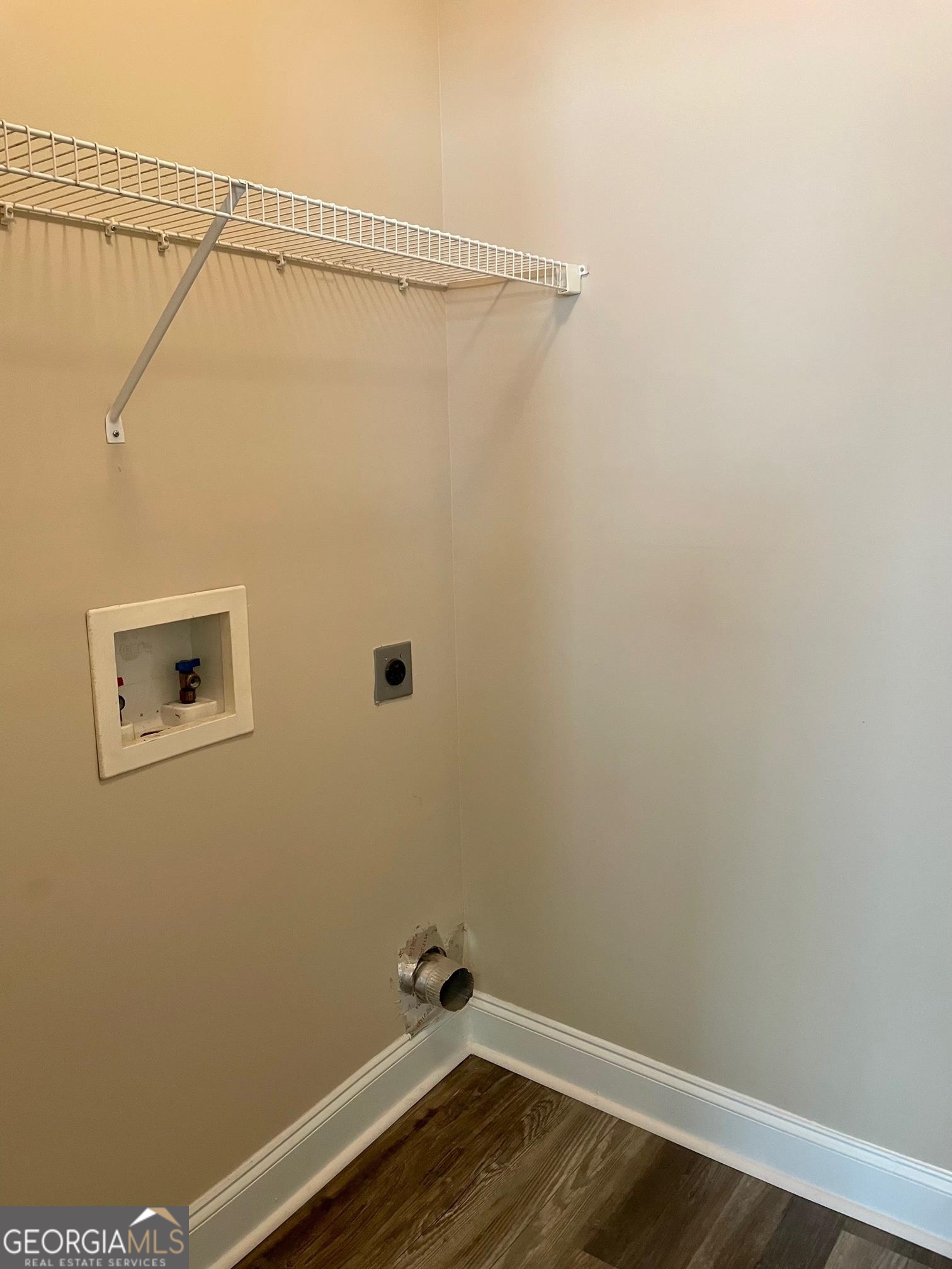 5371 Apple Grove Road Northeast Buford, GA 30519 - Photo 16 of 17 a view of a room with wooden floor and fan