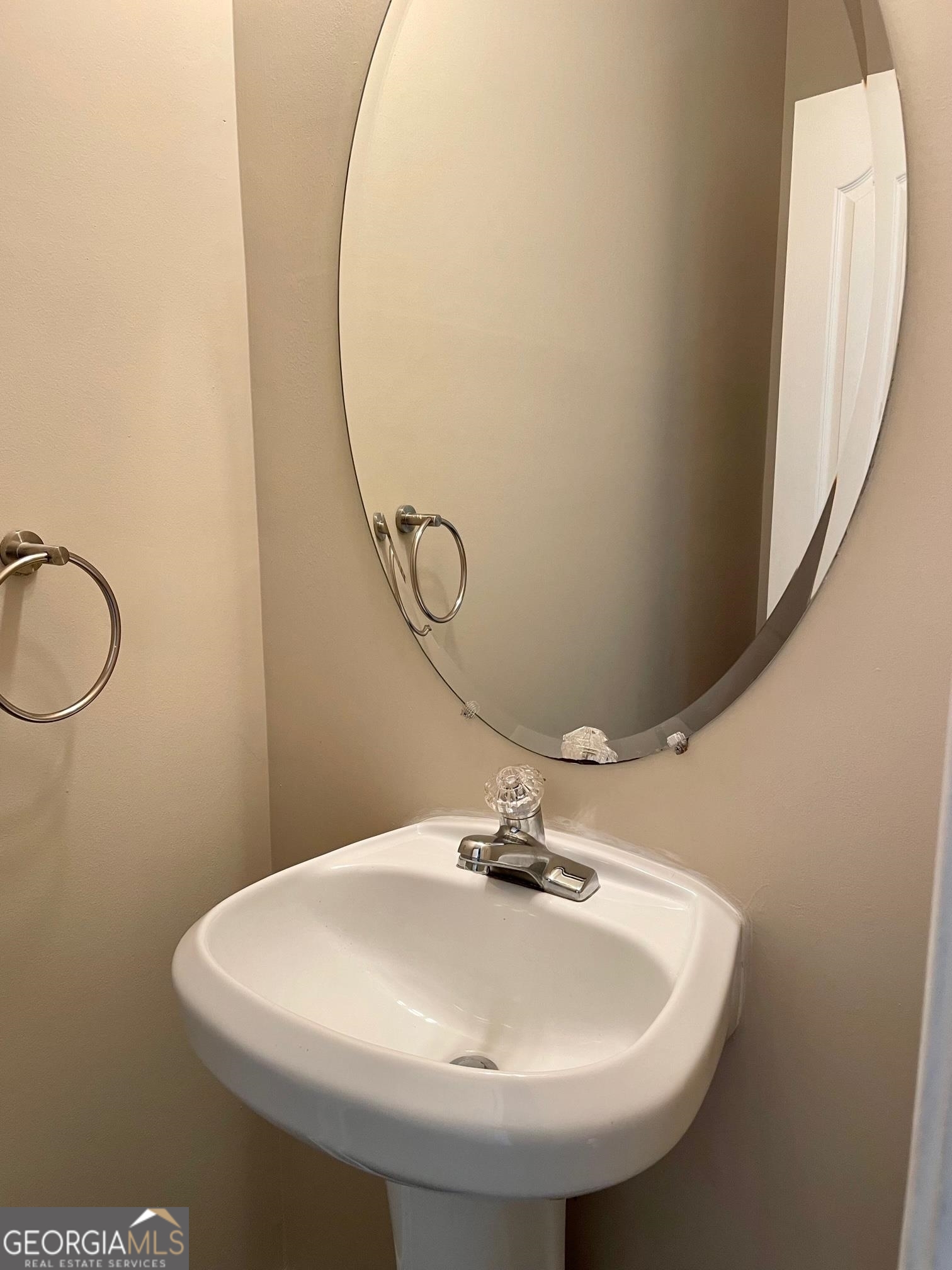5371 Apple Grove Road Northeast Buford, GA 30519 - Photo 7 of 17 a bathroom with a sink and mirror