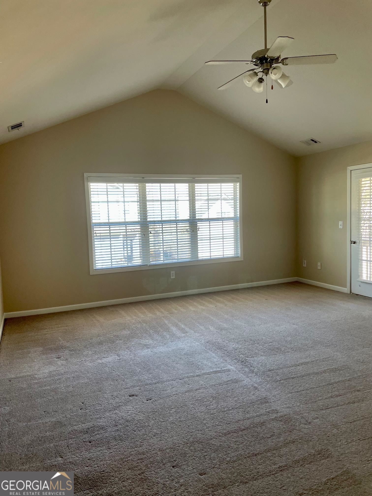 5371 Apple Grove Road Northeast Buford, GA 30519 - Photo 8 of 17 a view of an empty room with a window