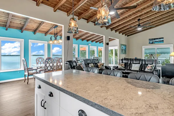 a kitchen with granite countertop a sink cabinets and window