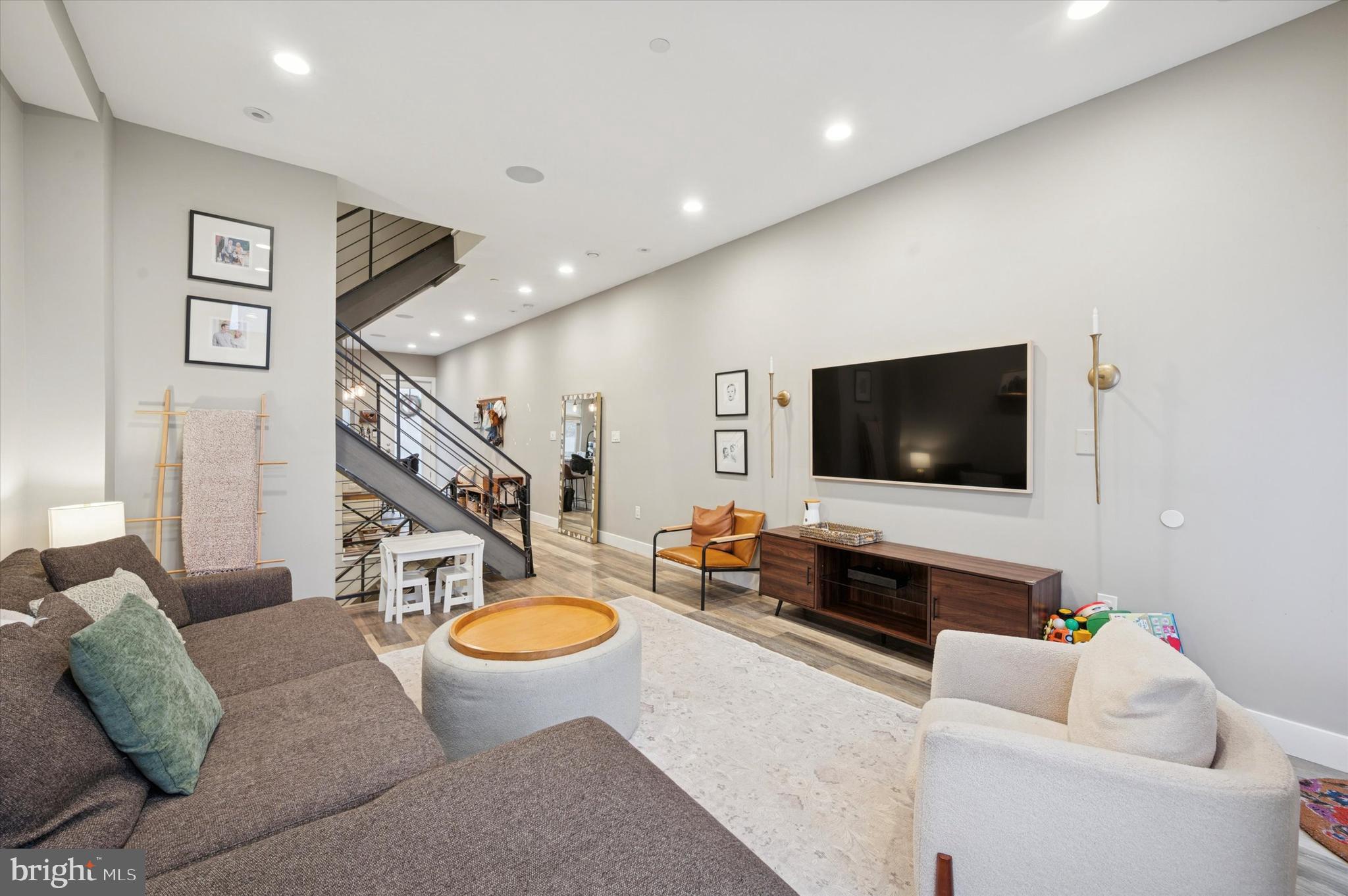 1942 Tasker Street Philadelphia, PA 19145 - Photo 11 of 35 a living room with furniture and a flat screen tv