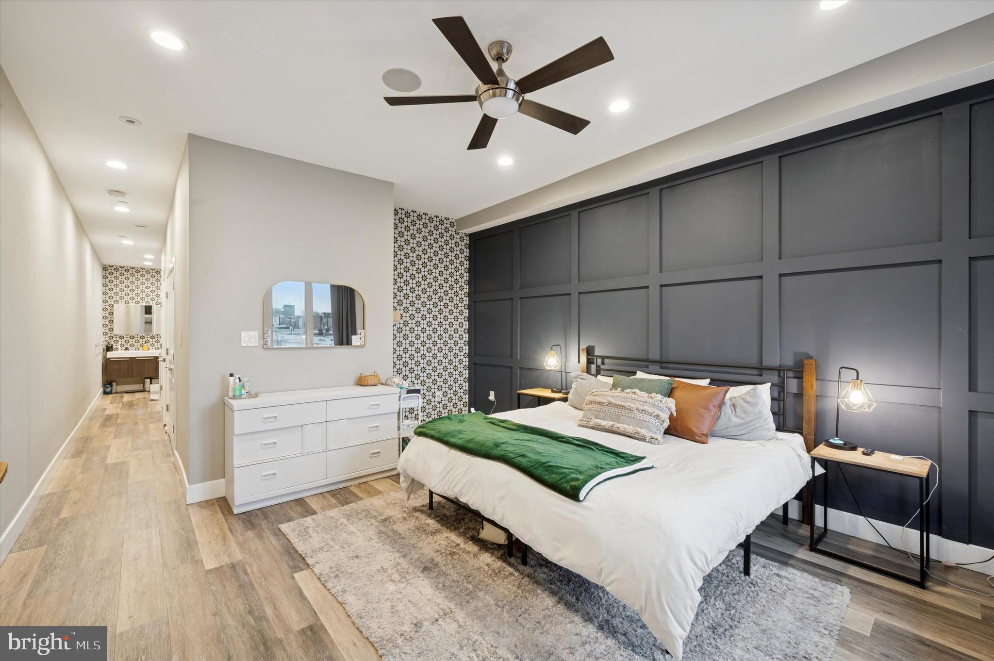 1942 Tasker Street Philadelphia, PA 19145 - Photo 13 of 35 a bedroom with a bed and a chandelier