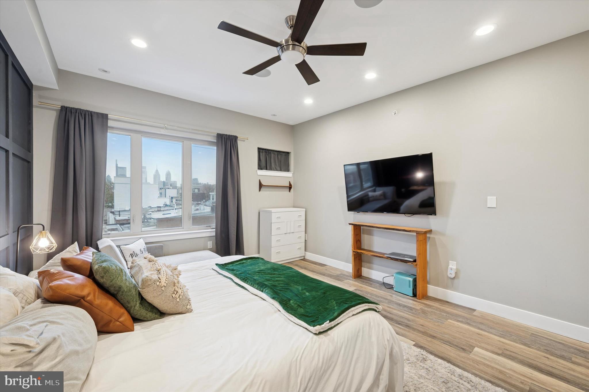 1942 Tasker Street Philadelphia, PA 19145 - Photo 14 of 35 a bedroom with a bed and a flat screen tv