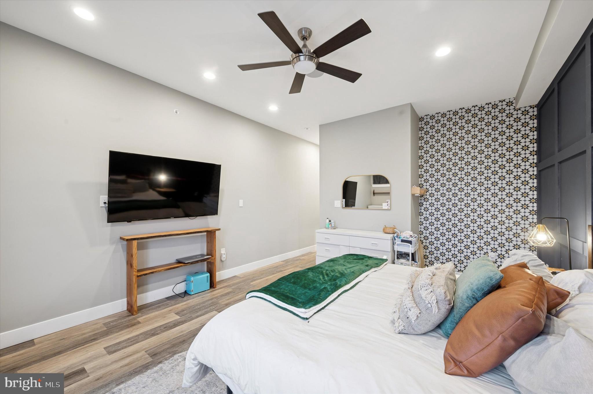 1942 Tasker Street Philadelphia, PA 19145 - Photo 16 of 35 a bedroom with a bed and a flat screen tv