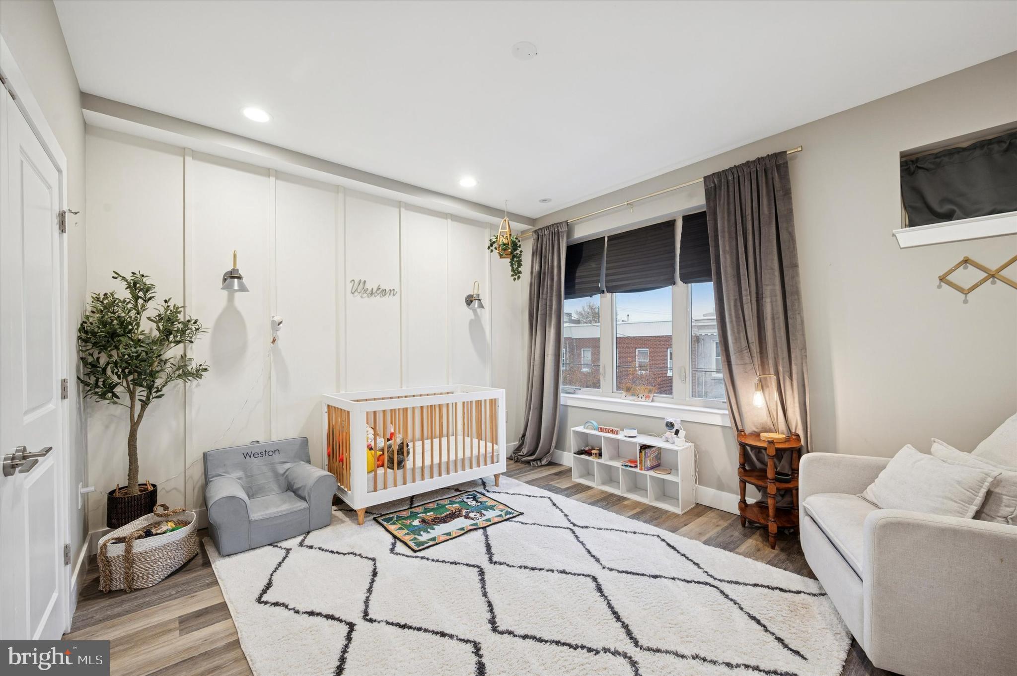 1942 Tasker Street Philadelphia, PA 19145 - Photo 19 of 35 a living room with furniture and a flat screen tv