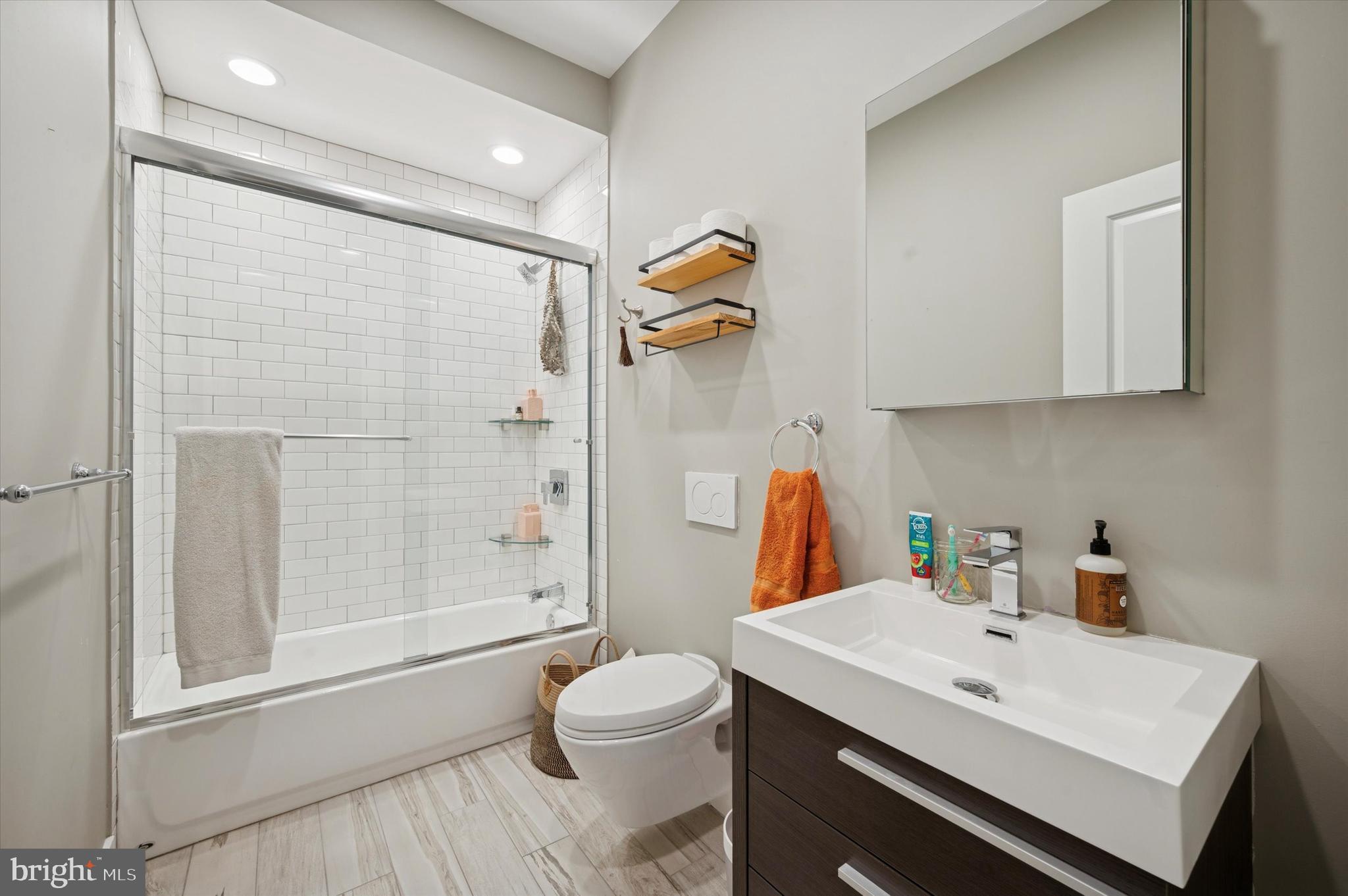 1942 Tasker Street Philadelphia, PA 19145 - Photo 21 of 35 a bathroom with a sink a toilet and shower