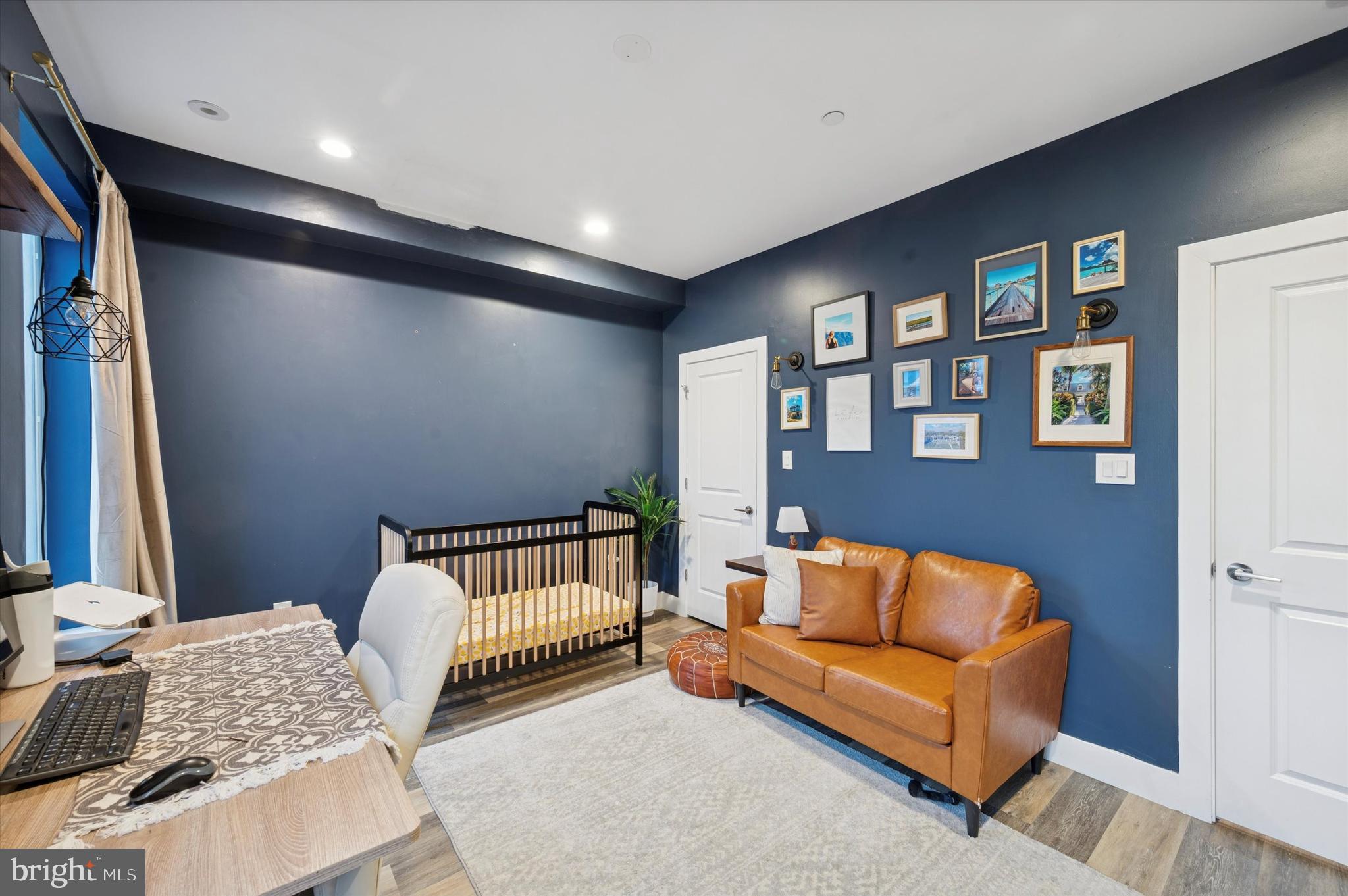 1942 Tasker Street Philadelphia, PA 19145 - Photo 23 of 35 a bedroom with furniture and a couch