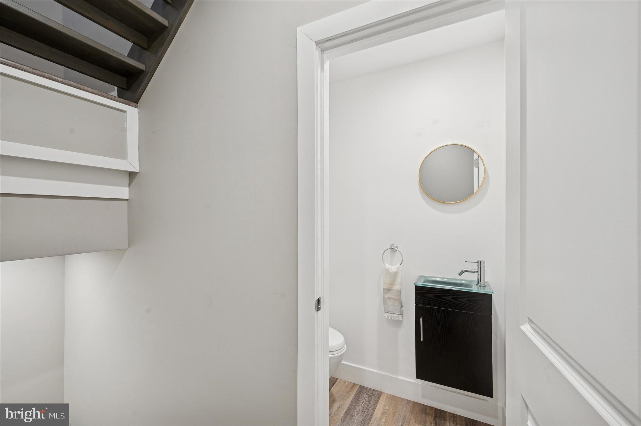 1942 Tasker Street Philadelphia, PA 19145 - Photo 27 of 35 a view of a storage & utility room with racks on the wall