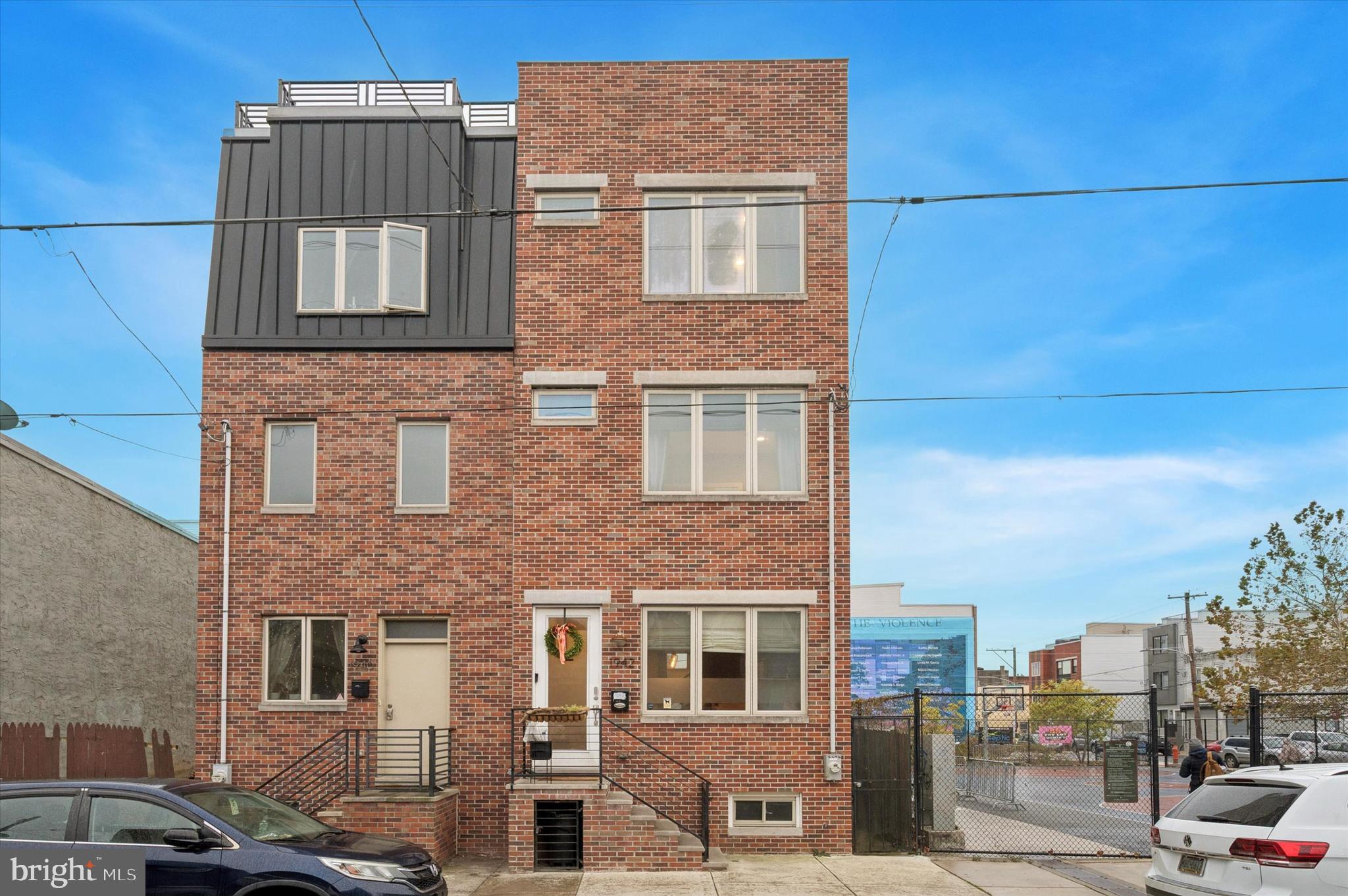 1942 Tasker Street Philadelphia, PA 19145 - Photo 33 of 35 a front view of a building with a street