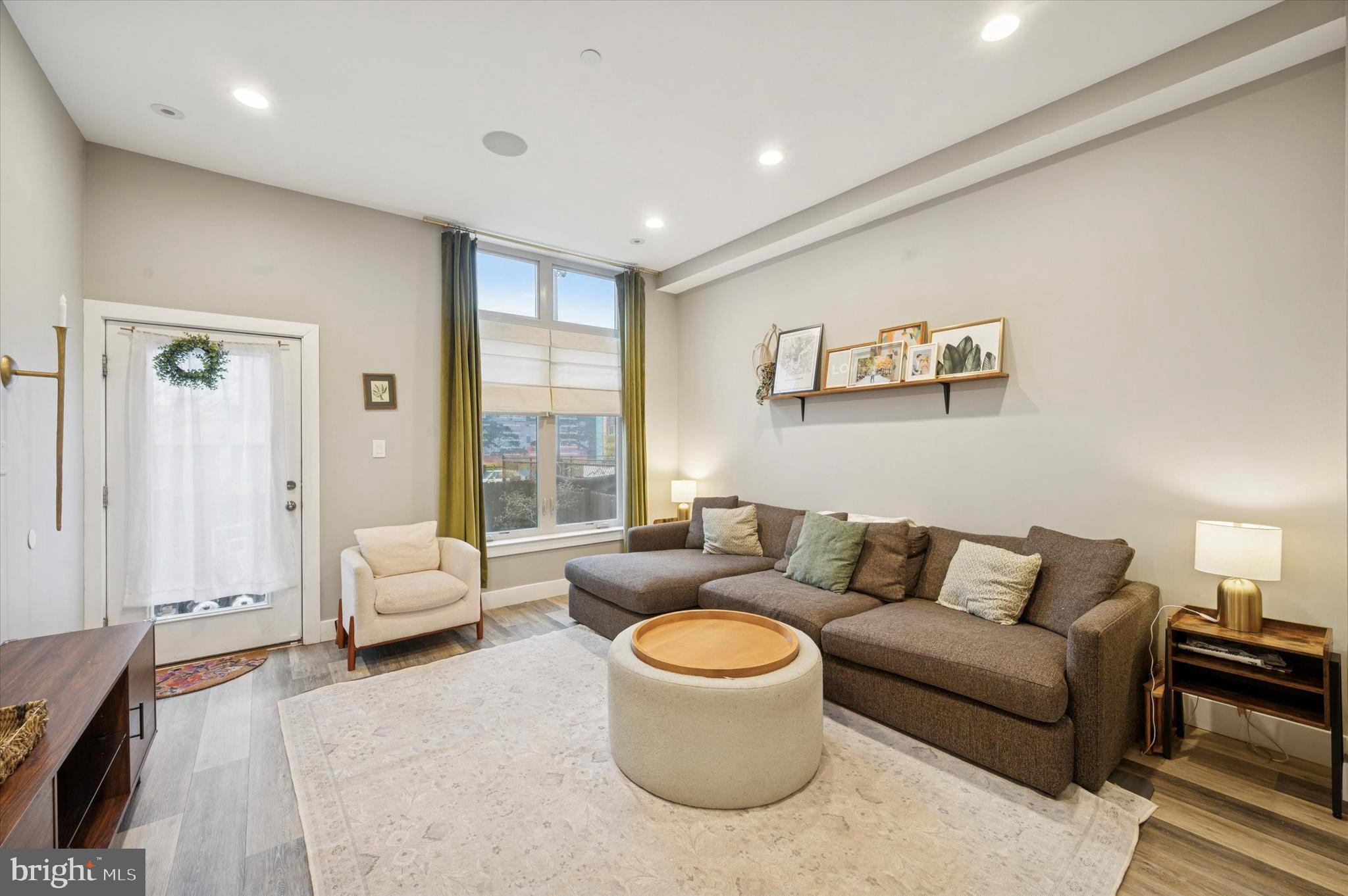 1942 Tasker Street Philadelphia, PA 19145 - Photo 8 of 35 a living room with furniture and a large window