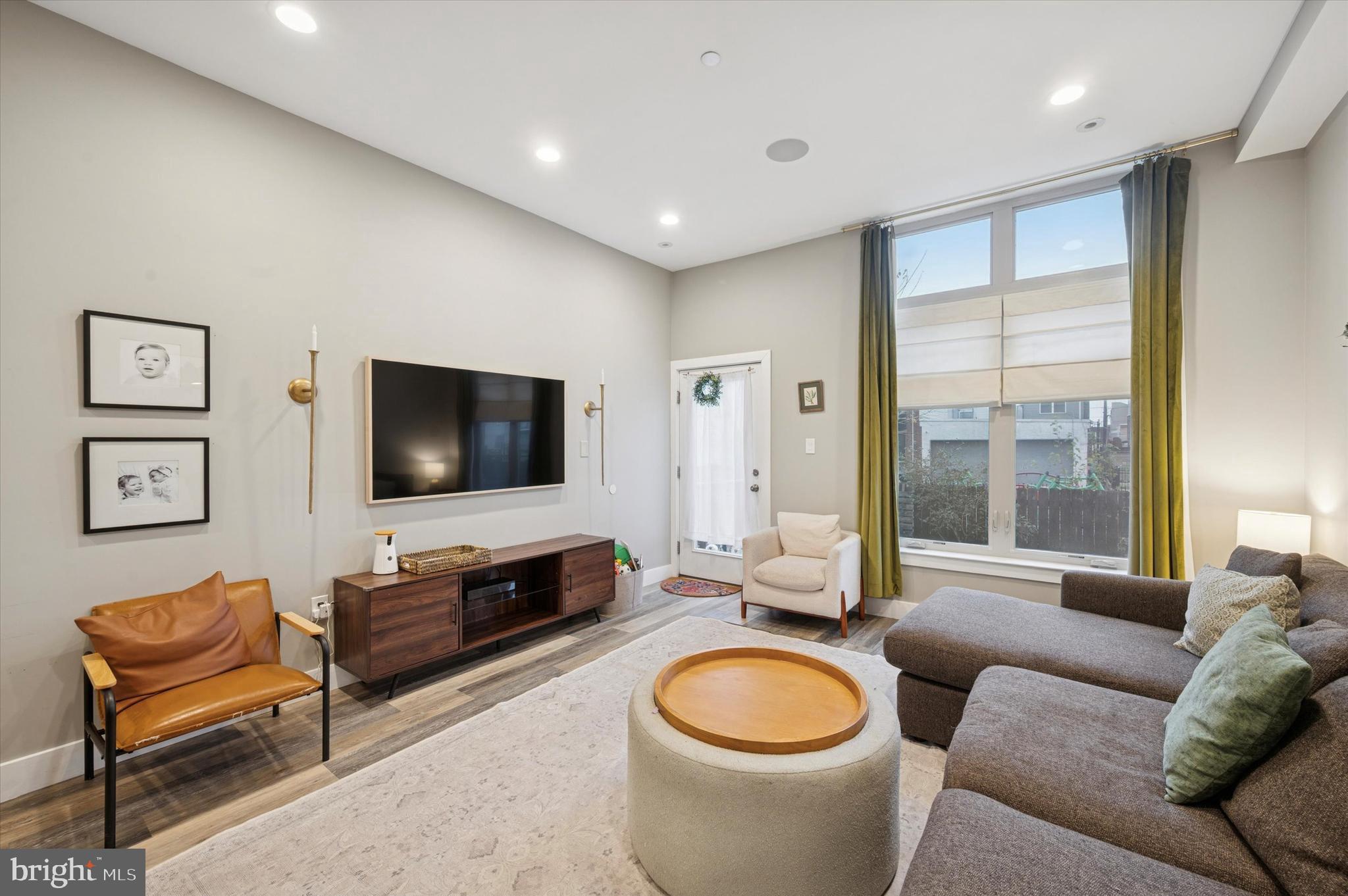 1942 Tasker Street Philadelphia, PA 19145 - Photo 9 of 35 a living room with furniture and a flat screen tv