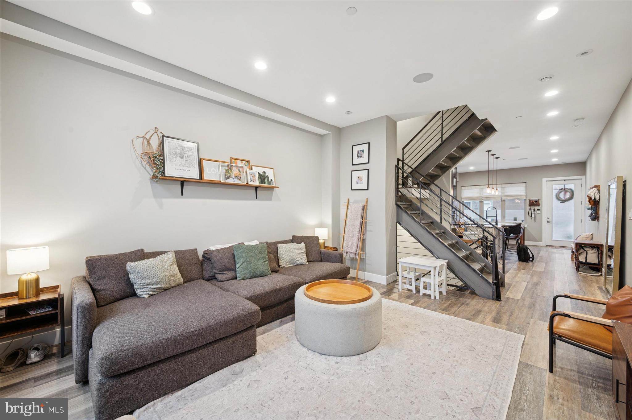 1942 Tasker Street Philadelphia, PA 19145 - Photo 10 of 35 a living room with lots of furniture and a painting