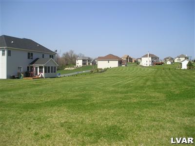 144 Heyer Road Nazareth, PA 18064 - Photo 30 of 31 a backyard of a house with table and chairs