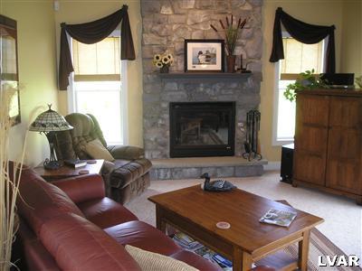 144 Heyer Road Nazareth, PA 18064 - Photo 8 of 31 a living room with furniture and a fireplace