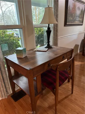 a kitchen with stainless steel appliances kitchen island granite countertop a refrigerator and a sink